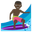 person surfing dark skin tone